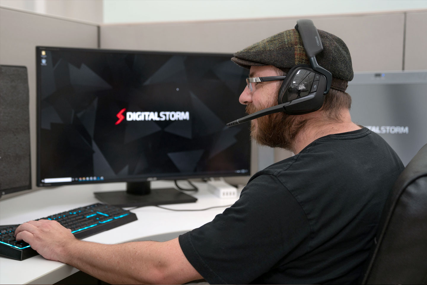 satisfied looking person working on a computer with headset